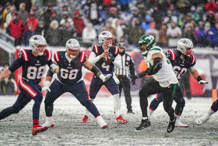 New England Patriots quarterback Bailey Zappe (4) looks to pass the ball against the New York Jets in the second half at Gillette Stadium.